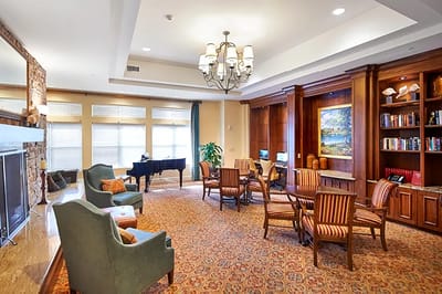 Interior common area with seating and a piano