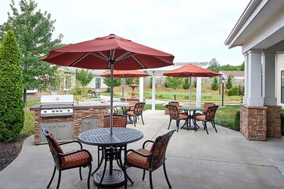 Outdoor patio area with seating and umbrellas