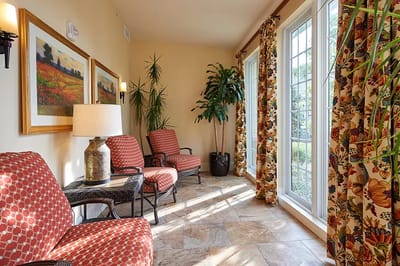 Bright common area with seating and large windows