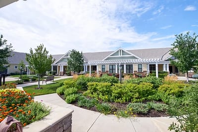Exterior view of a beautifully landscaped assisted living facility