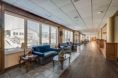 Common area lounge with comfortable seating and natural light