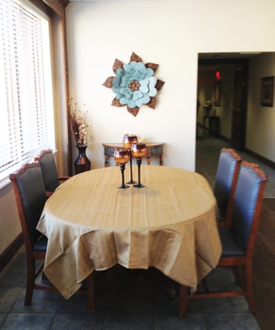 A cozy dining area with a floral decoration