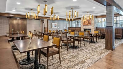 Spacious dining room with tables and chairs