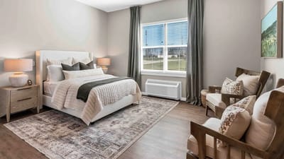 A tastefully decorated bedroom with natural light