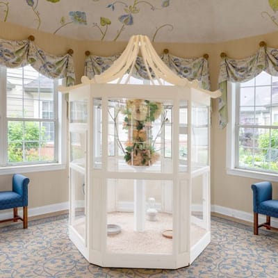 Interior view of a decorative space with a chandelier and seating