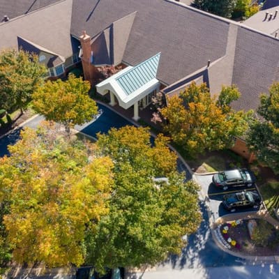 Aerial view of a senior living facility with fall foliage
