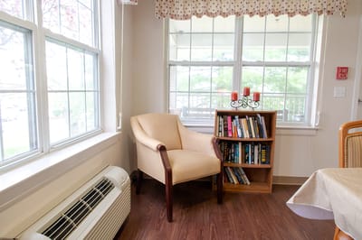 Cozy reading corner with chair and bookshelf