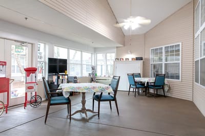 Bright, inviting common area with tables and chairs