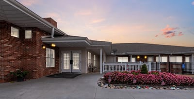 Exterior view of the facility with landscaped flowers
