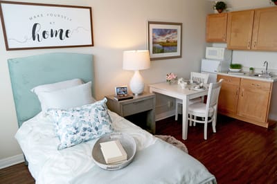 Cozy private resident room with a bed and kitchenette