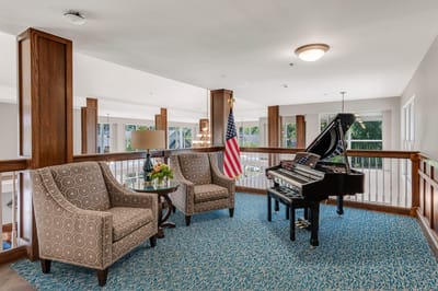 Interior common area with seating and a piano