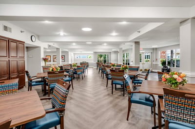 Bright common area with tables and chairs