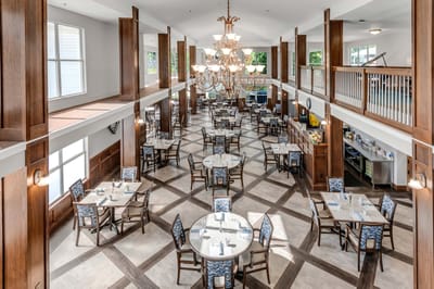 Bright dining area with tables and chairs