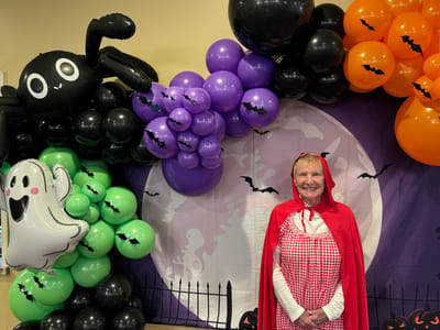 Resident celebrating Halloween in a decorated interior