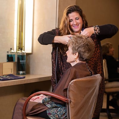 Resident getting a haircut in a salon