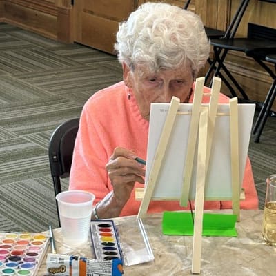 Resident painting during a recreational activity