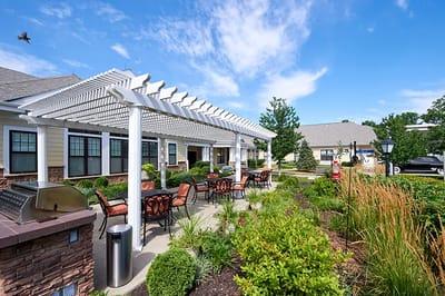 Outdoor patio area with seating and landscaping