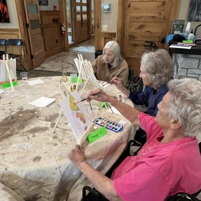 Residents engaged in a painting activity in a common area