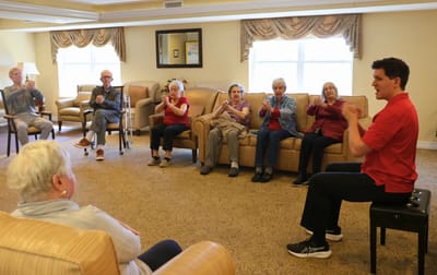 Residents participating in an activity session with staff