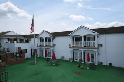 Outdoor seating area with tables and umbrellas