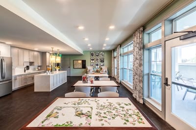 Bright dining area with tables and large windows