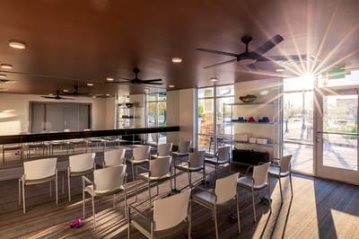 Bright interior of a common area with chairs set up for an event