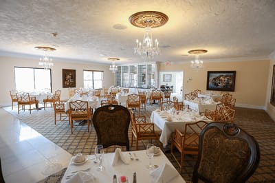Elegant dining room setup in a retirement facility