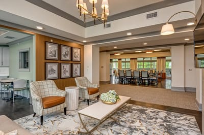 Bright common area with seating and dining space