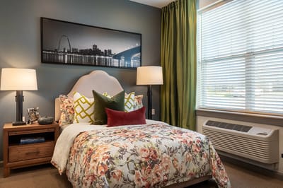 Cozy private resident room with floral bedding