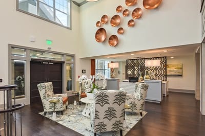Bright interior common area with seating and decorative elements