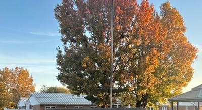 Outdoor view of a senior living facility with autumn trees