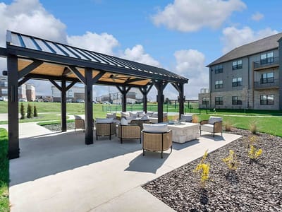 Outdoor seating area with a pavilion in a senior living community
