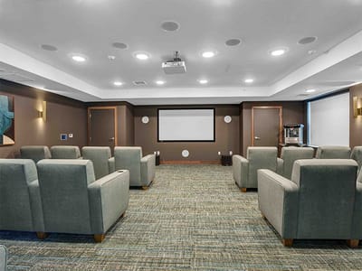 Interior view of a well-lit activity room with seating