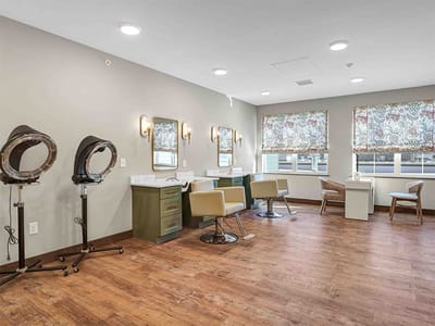 Interior beauty salon area with styling chairs