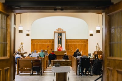 Residents participating in a service in the chapel