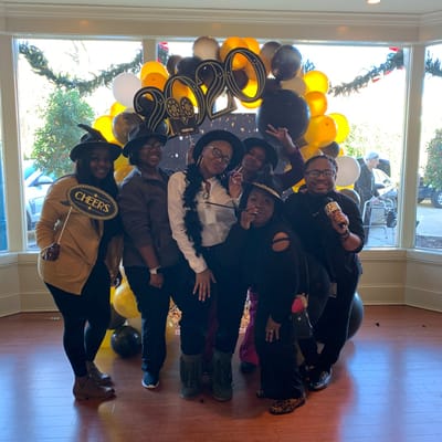 Residents and staff celebrating New Year's Eve
