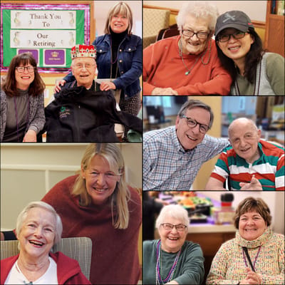 Residents and staff celebrating in the activity room