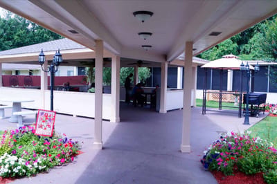 Outdoor seating area with residents enjoying time together
