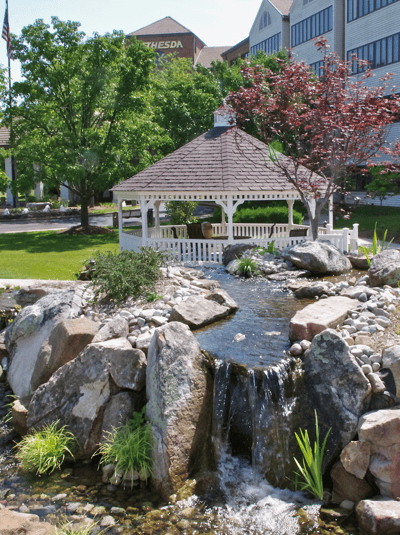 Beautiful garden with gazebo and waterfall feature