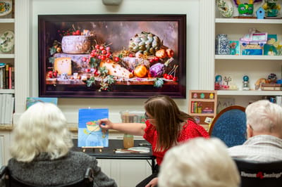 Residents watching an art activity session