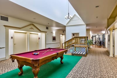Interior view of a recreation area with a pool table