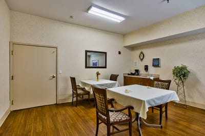 Bright common area with tables and chairs