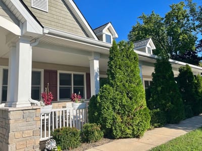 Exterior view of a senior living facility with landscaping