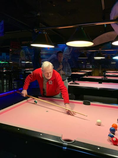 Residents playing pool in a recreational area