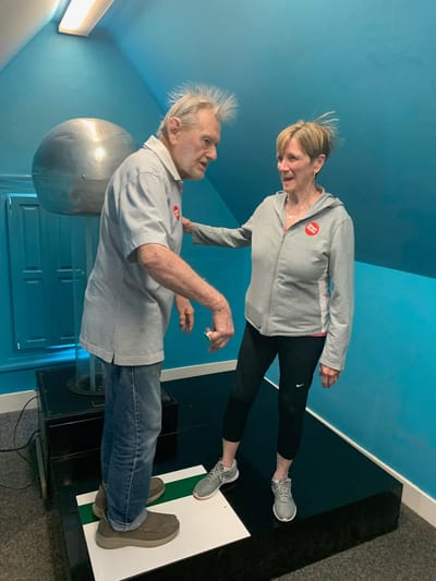 Two residents engaging in an activity indoors
