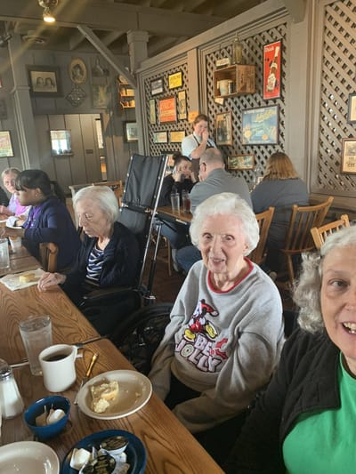 Residents sharing a meal in a dining area