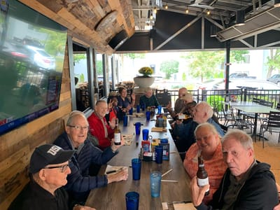 Residents enjoying a meal and socializing outdoors