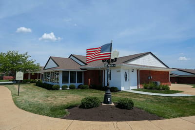 Exterior view of the facility with American flag