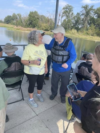 Residents enjoying an outdoor activity by a lake