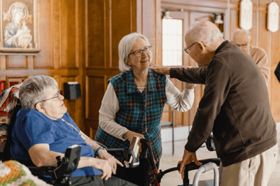 Residents interacting in a warmly decorated common area